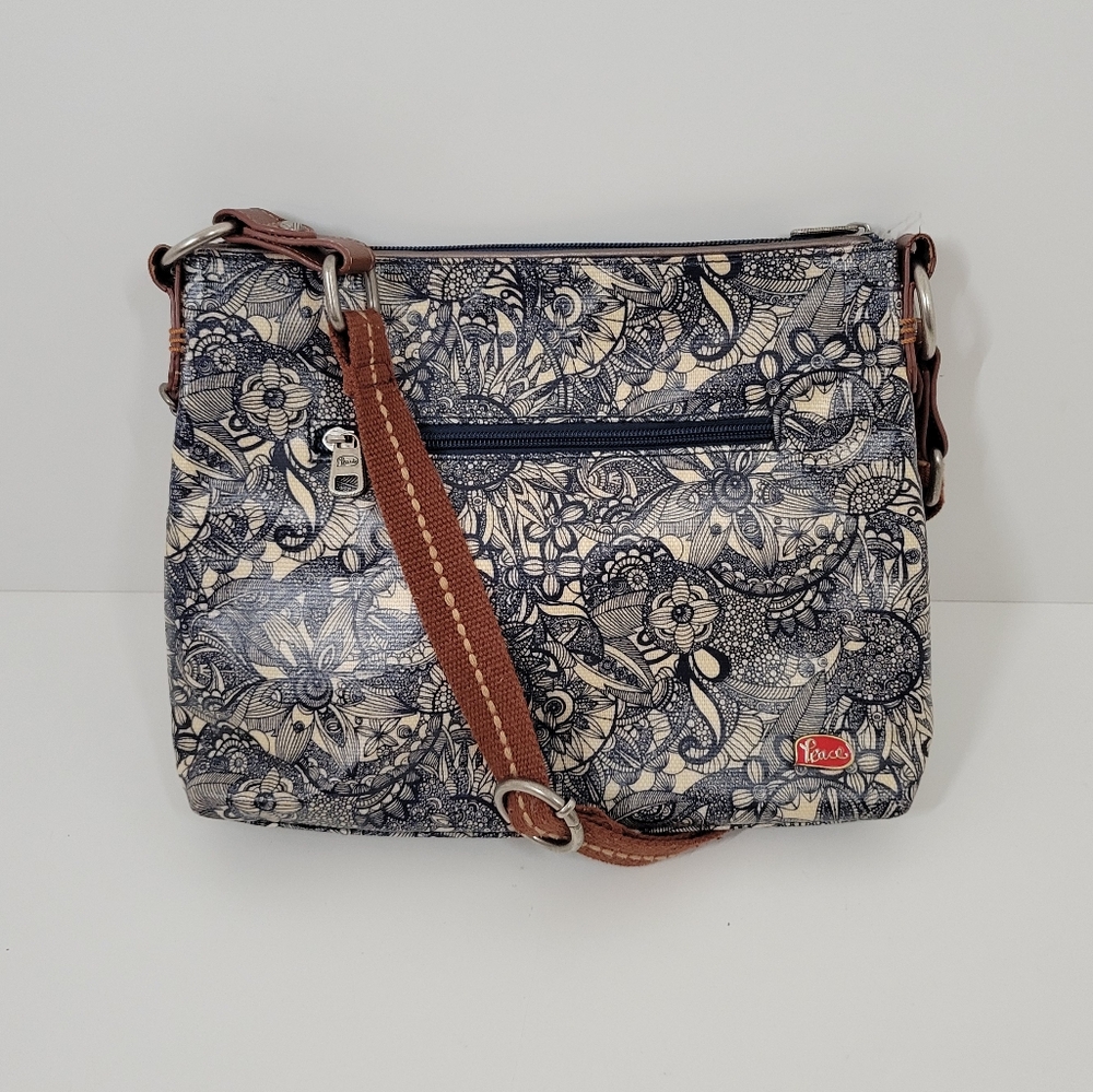 The Sakroots Blue Floral Coated Canvas Brown Adjustable Strap Crossbody Bag